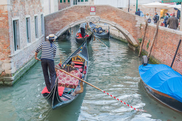 Fototapeta na wymiar People in Venice gondolas