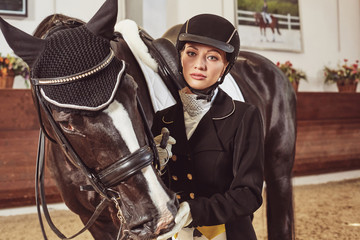 woman jockey with his horse