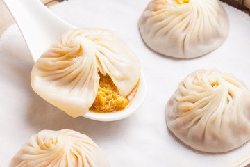 Xiao Long Bao in spoon show its stuff round with another