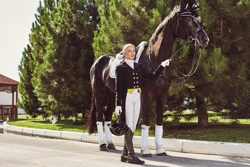 woman jockey with his horse