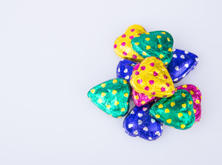 Chocolate or Colorful heart shape chocolate on a background.