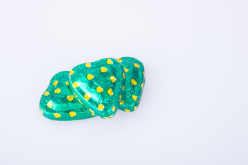 Chocolate or Colorful heart shape chocolate on a background.