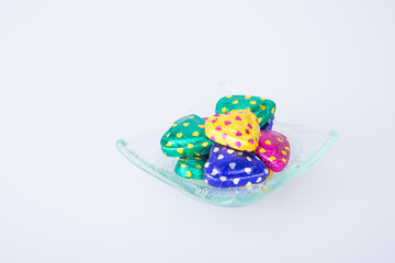 Chocolate or Colorful heart shape chocolate on a background.
