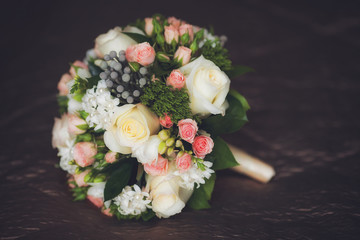 Close up of beautiful wedding bouquet on dark background