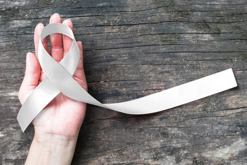 White/ light pearl color ribbon isolated on white background symbolic concept for raising awareness on Lung cancer and no male violence against women (clipping path) - obrazy, fototapety, plakaty