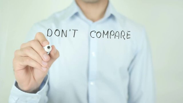 Don't Compare Yourself With Others&nbsp;, Man Writing on Screen