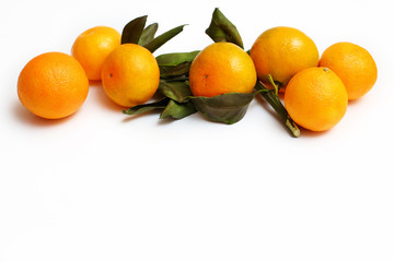 tangerines with leaves on a white background background with copy space