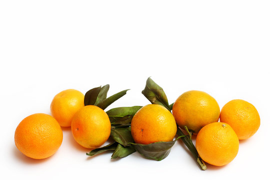 tangerines with leaves on a white background background with copy space