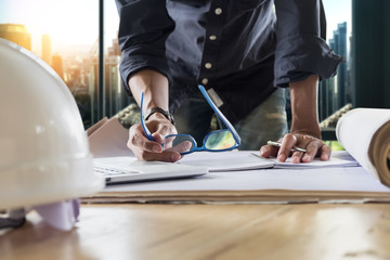 Young man working on his plane project at site construction work