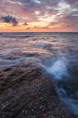 Long exposure sea and rocks at twilight