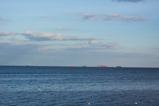 Landscape with cargo ships on horizon