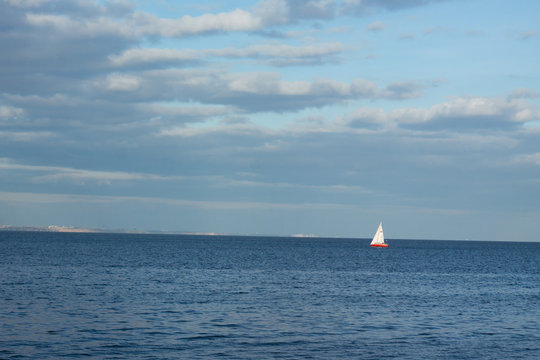 minimalistic landscape with sailing boat