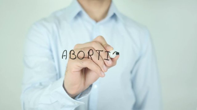 Abortion, Man Writing on Screen