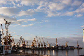Fototapeta premium industrial landscape with sea port,cranes and ships