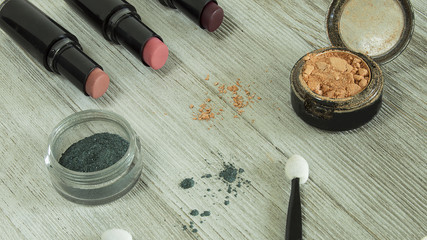 lipstick and eyeshadow scattered