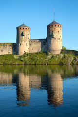 Fototapeta na wymiar Two towers of the medieval fortress Olavinlinna closeup. Savonlinna, Finland