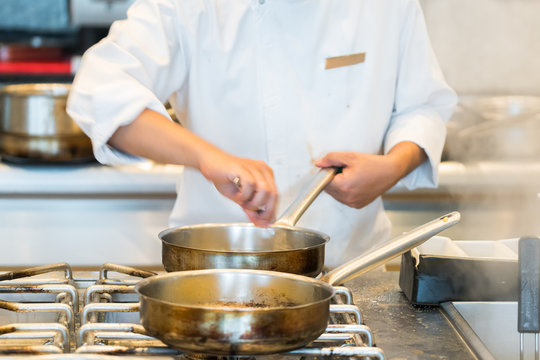 chef preparing food in a restaurant kitchen
