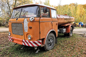 Old oragne water cistern truck