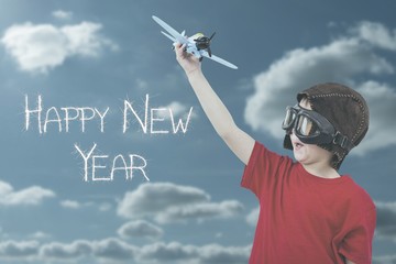 Composite image of boy playing with toy airplane - Powered by Adobe