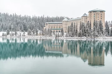 Foto op Canvas Winter reflection over Lake Louise Banff National Park Alberta Canada © Inger
