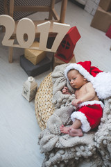 Obraz premium Newborn baby in Santa clothes