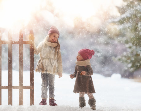 girls playing on a winter walk