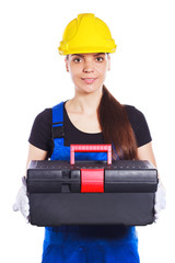 Woman builder in the uniform with a toolbox