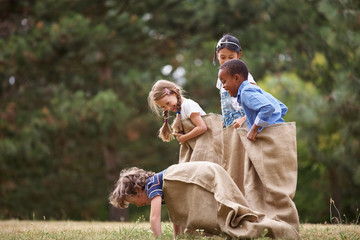 Kids competing at sack race