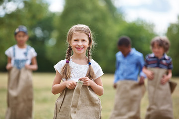 Girl with braided hair at sack race