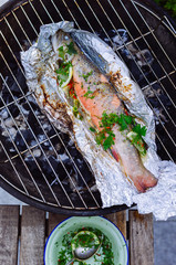 Grilled trout on charcoal grill