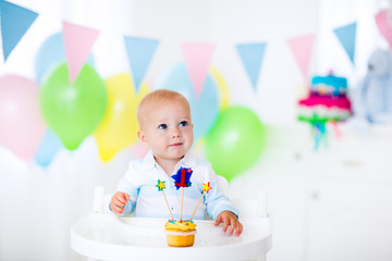 Little baby boy celebrating first birthday