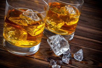 Decanter and two glasses with ice and whiskey