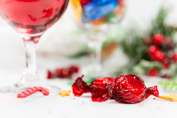 Close up of wine and sweets on a Christmas table.
