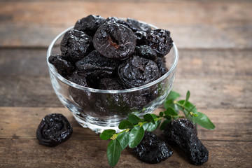 Dried plums - prunes in the bowl