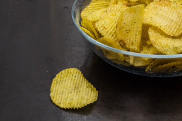 Potato chips in the glass bowl