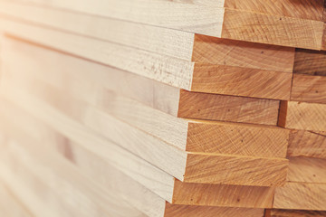 Wood timber construction material for background and texture. close up. Stack of wooden bars. small depth of field