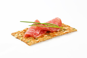 pumpkin seed cracker with dry salami
