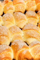 Fresh croissant on wooden background