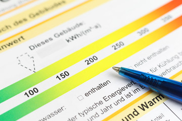 energy pass accoring german law with blue pen, symbol for saving energy
