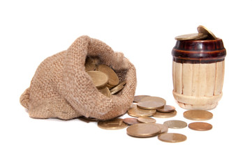 Bag with coins barrel with coins on a white background.