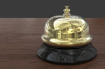 Welcome. 3D render of Brass Reception Bell. Wooden Desk background.