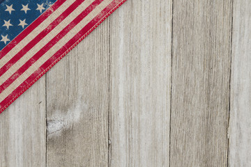 USA patriotic old flag on a weathered wood background