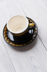 brown cup and saucer
