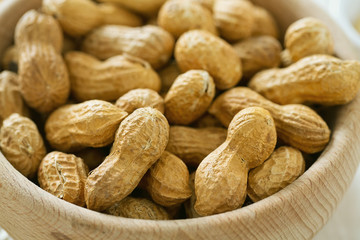 peanuts on wooden surface