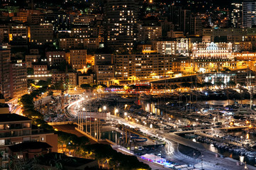 Fototapeta na wymiar Port and the city at night lights with many luxury yachts in Europe. Monte Carlo, Monaco, France.