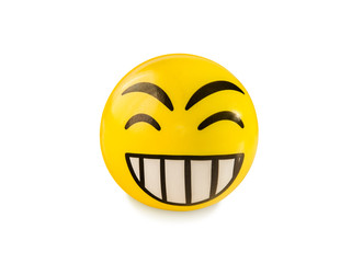 Fototapeta premium Laughing emoticon toy ball isolated over white.