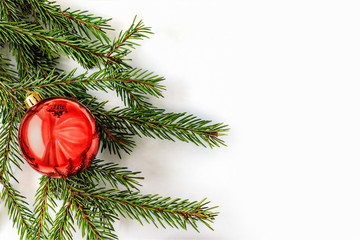 Red ball on the Christmas tree. White background