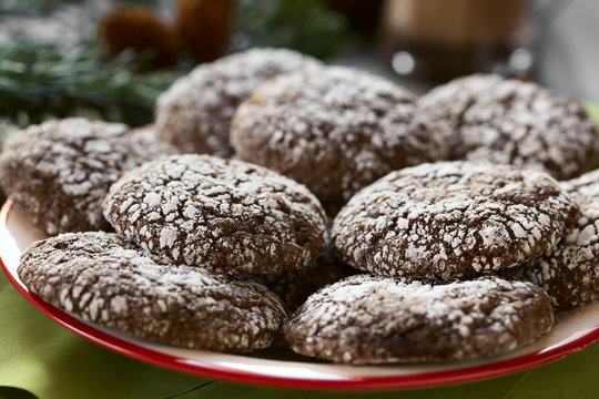 Chocolate crinkle cookies, traditional American Christmas cookies, photographed with natural light (Selective Focus, Focus one third into the image)