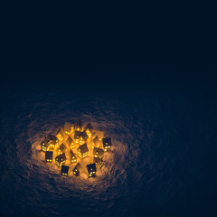 hell erleuchtetes Dorf in der Dunkelheit