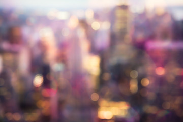 Defocused abstract metropolitan city blur of buildings with lens flare shot in New York City